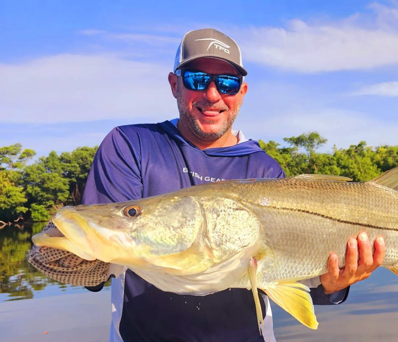 Captain Santiago Javier Aldrey holding a giant snook on Laguna San José