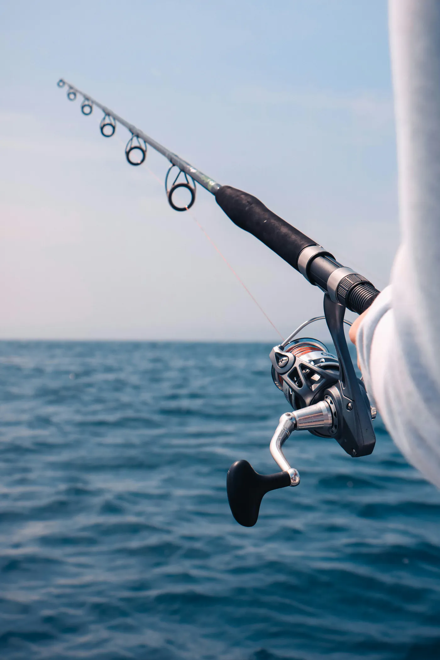 Light spinning reel and rod ready aboard the charter